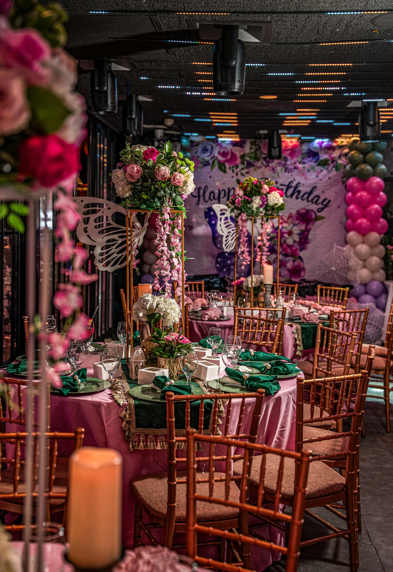 Elegant birthday reception with flowers and balloons